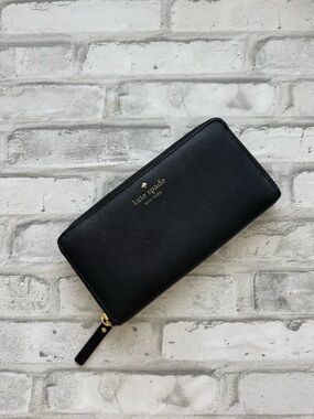 kate spade black leather zip-around wallet with gold logo